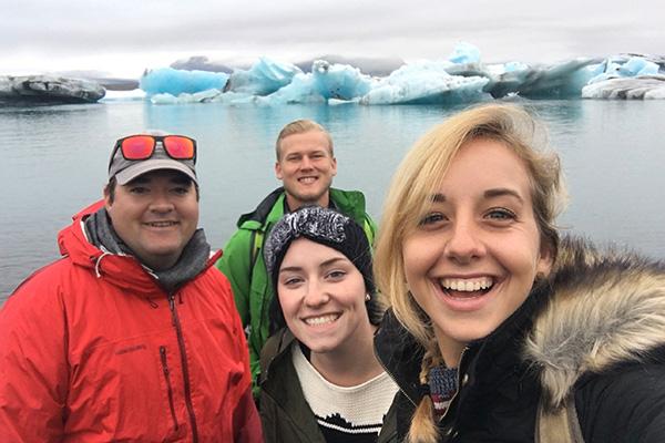 Students posing for a selfie while studying abroad in Iceland.